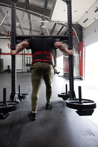 Strongman doing yoke runs