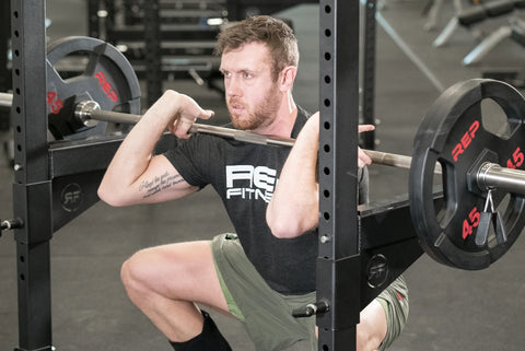A man doing front squats