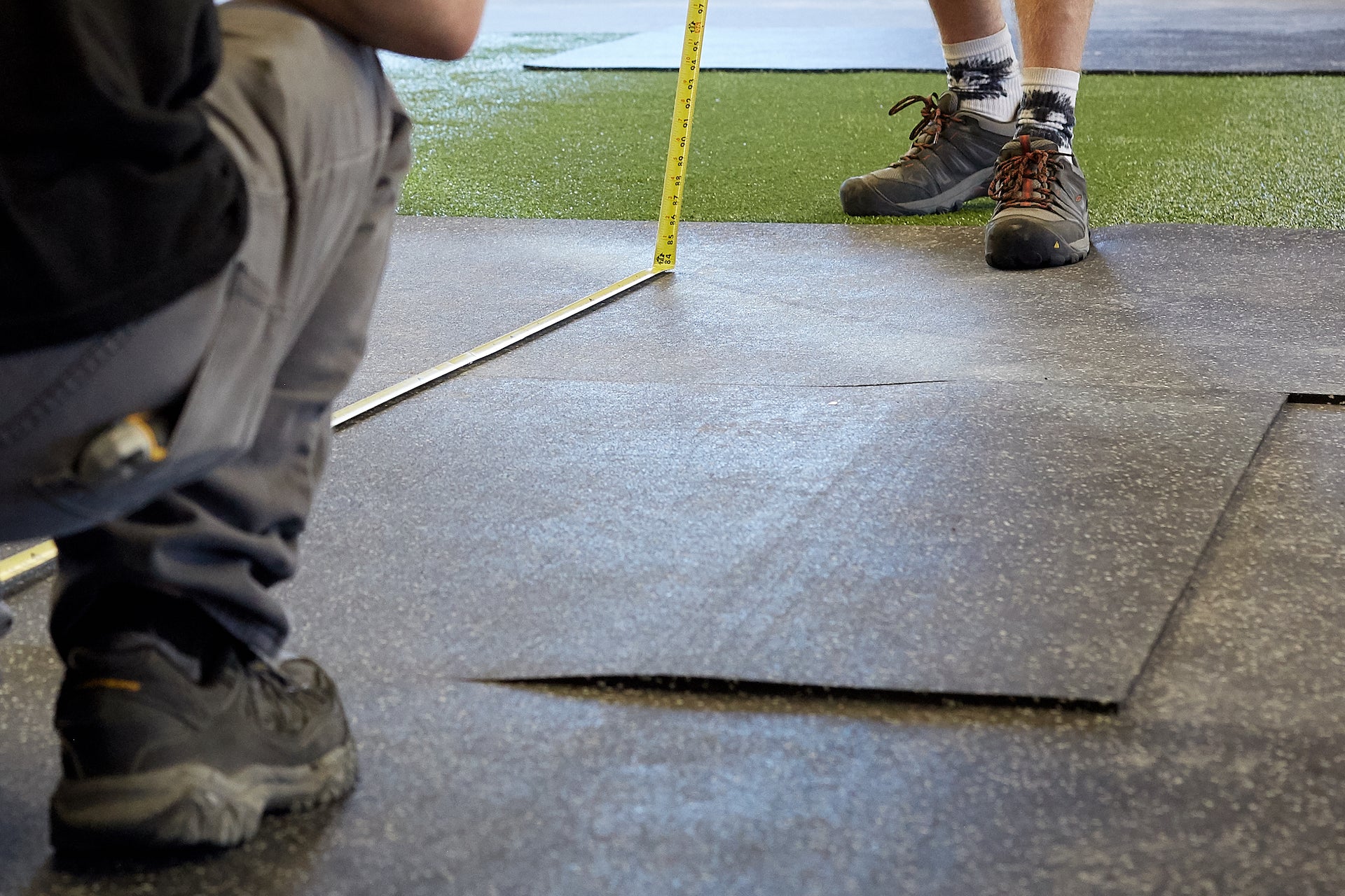 People installing gym flooring