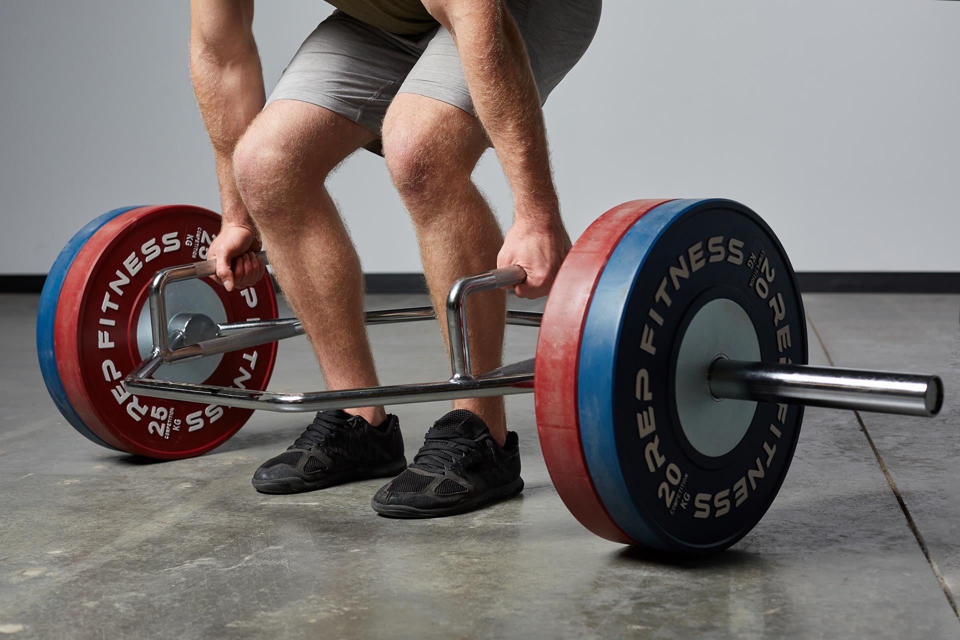 Close Up of Trap Bar With Bumper Plates Loaded On