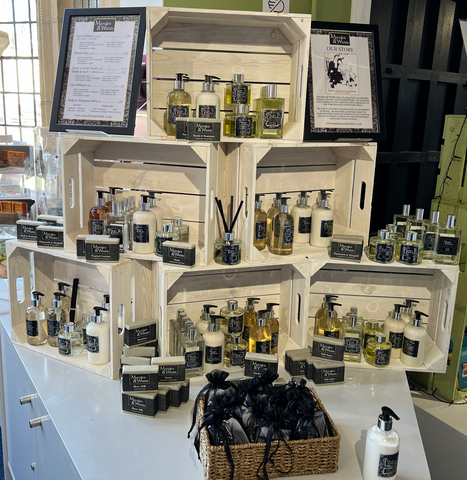 Several white product crates with Marsden & Whittle home fragrance products displayed inside the Port Sunlight Museum Shop.