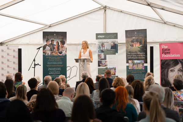 Katie Piper, OBE, welcoming guests with an opening speech at the start of the event