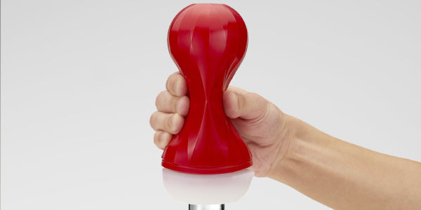 A hand squeezing an Air-Tech Squeeze Regular