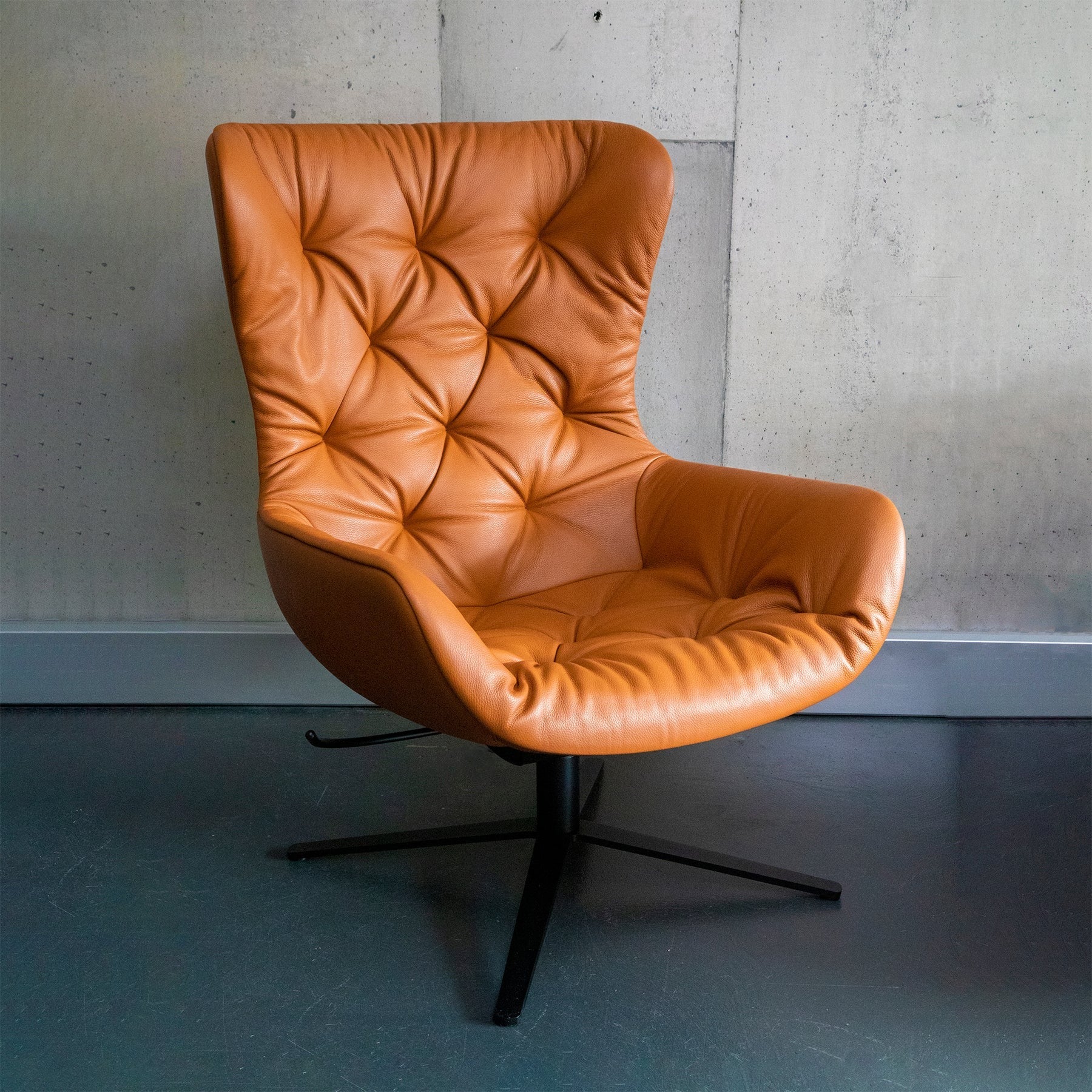freifrau | leya wingback chair chesterfield stitch | cognac leather | x-base frame + tilt
