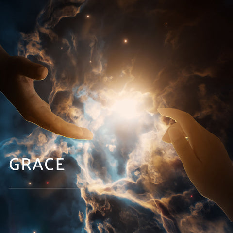 One of the powerful spiritual words, grace, appearing on an image with two hands in front of a beautiful nebula.