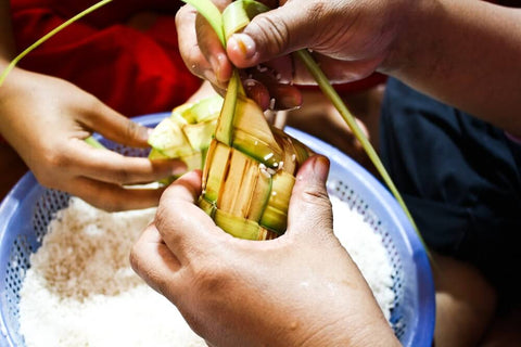 The making of Ketupat is a labour-intensive process that makes it a communal effort. Photo by Sham Hardy.