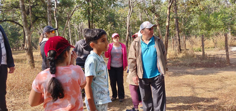 Kids and adults in a forest