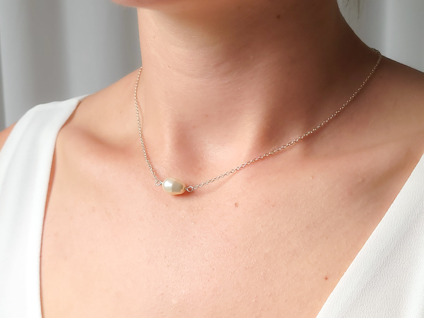 woman wearing sterling silver pearl necklace, teardrop pearl necklace, pear shaped pearl necklace, hypoallergenic necklace