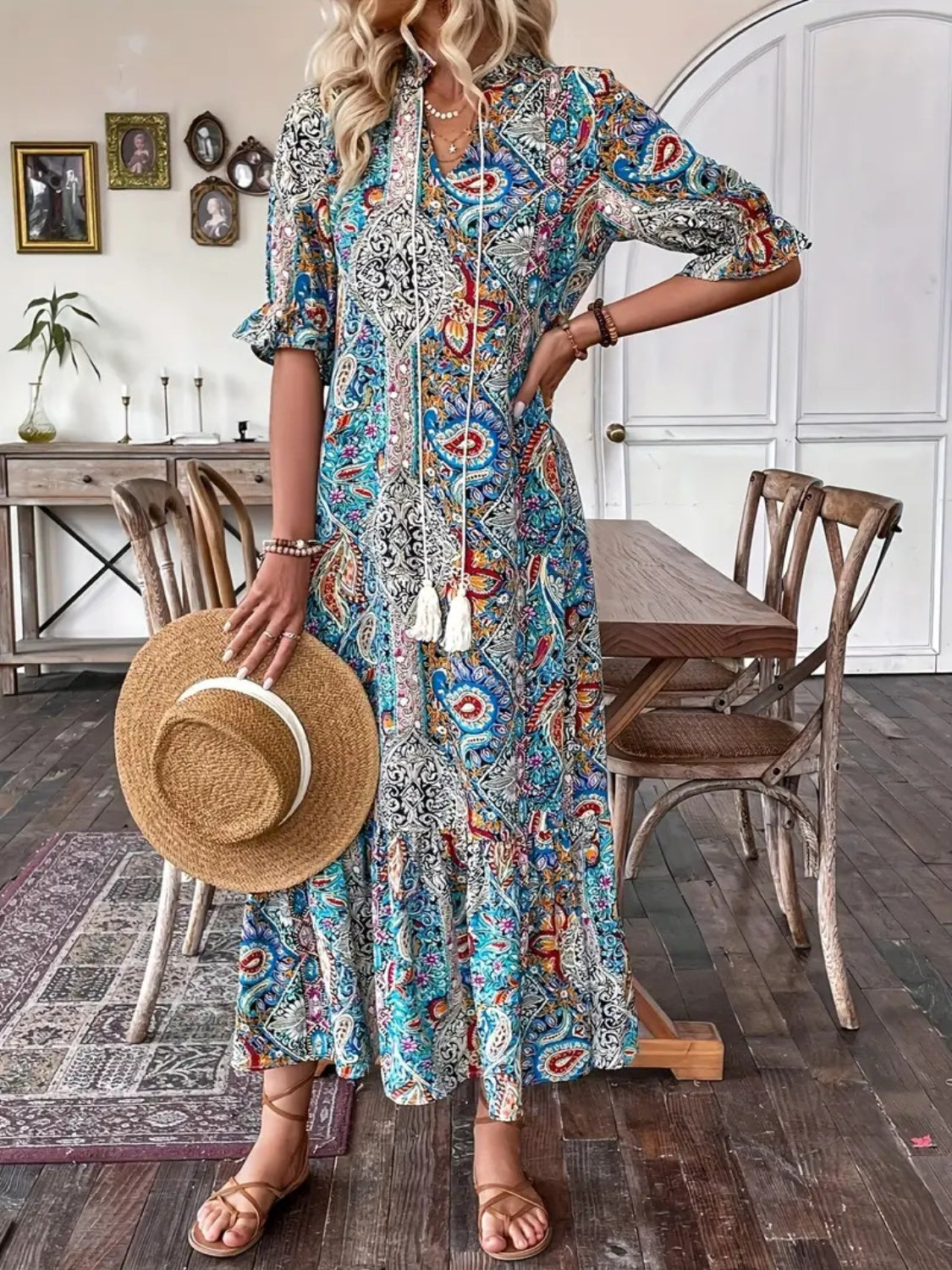 Printed midi dress featuring tie neck and flounce sleeves, perfect for a feminine touch.
