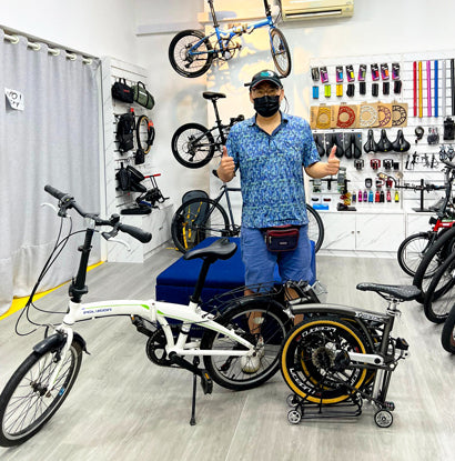 Satisfied customer trading in an old mountain bike for a new road bike at The Bike Atrium.