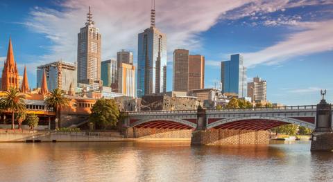 Image of the Melbourne CBD skyline on dusk with the Yarra River in the foreground.