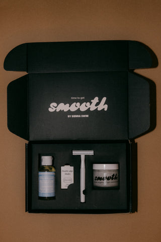 SMOOTH KIT contains a 2 ounce Dr. Bronner's Castille soap, 5-pack of blades, safety razor in either white or black, and a 6-ounce glass jar of coconut oil.