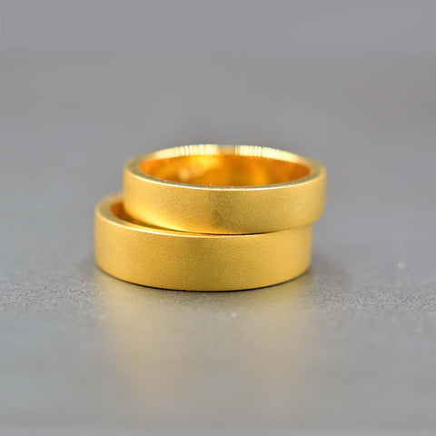 22k wedding bands with matte finish is totally modern and beautiful! None can be equally the same as these, because they were made by hand by Shiraz Jewelry in Chiang Mai, Thailand