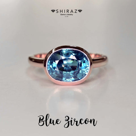 Blue zircon in modern full bezel setting in romantic rose gold. Custom made blue zircon ring from Chiang Mai, Thailand