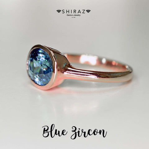 Romantic rose gold blue zircon ring. The ring is a custom made blue zircon ring from Chiang Mai, Thailand