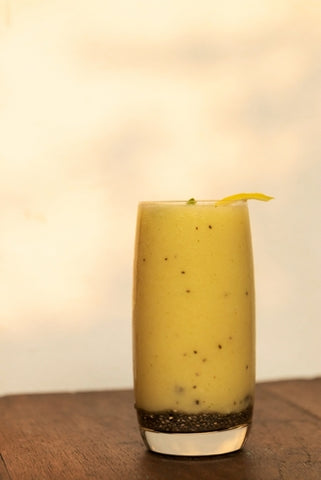 A sea moss smoothie against a pale brown background.
