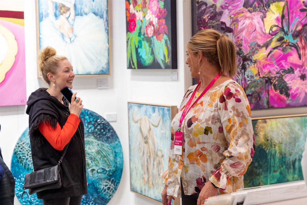 Kerry Bruce chatting with a visitor to the Affordable Art Fair