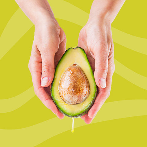 avocado in hand - a vegetable oil alternative