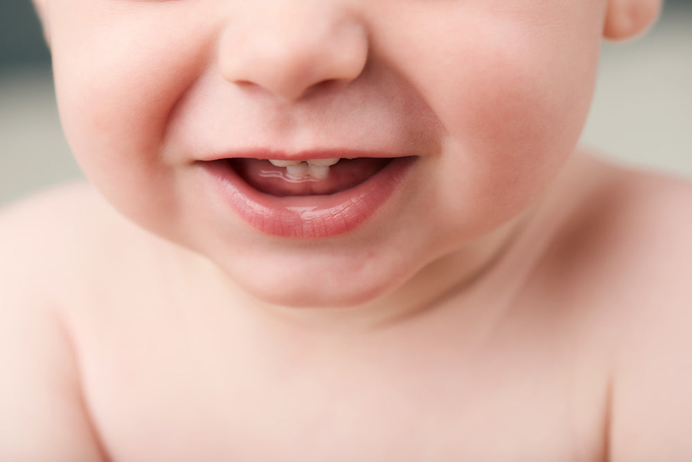 Toddler with two new teeth