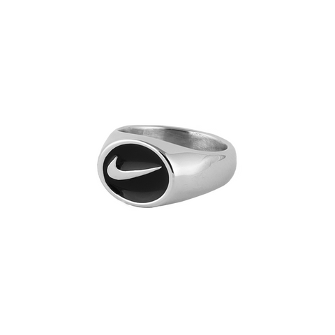 silver nike signet ring contrasted on a black front