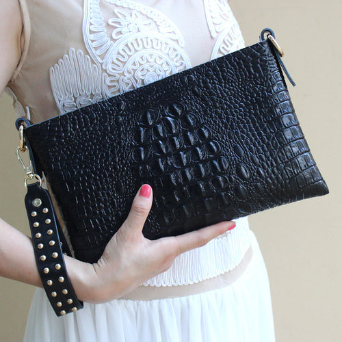 Women embossed hand bag with riveted strap