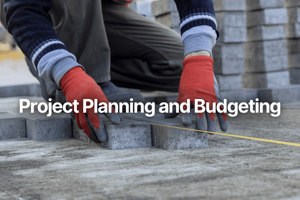 person with red gloves installing grey pavers