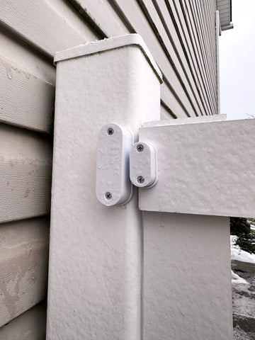 Eve door window contact sensor being used on an outdoor fence gate using a weatherproof enclosure