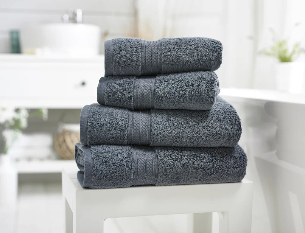 Bathroom essentials including soft towels, toiletries, and other accessories for dorm or apartment living.
