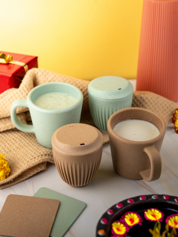 Collection of Irida's eco-friendly travel mugs in different colours and designs.