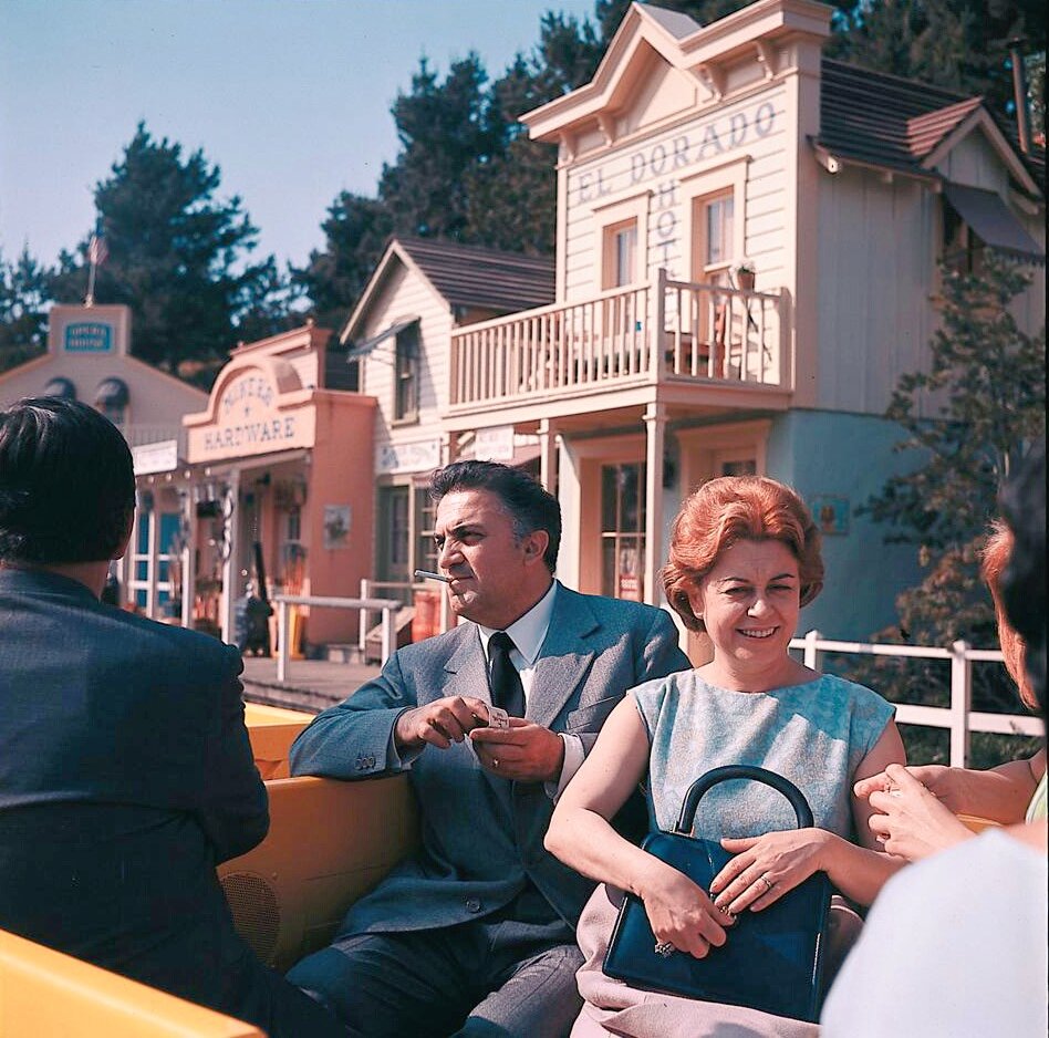 Federico Fellini and Giulietta Masina enjoy the amusements of Disneyland, 1964.