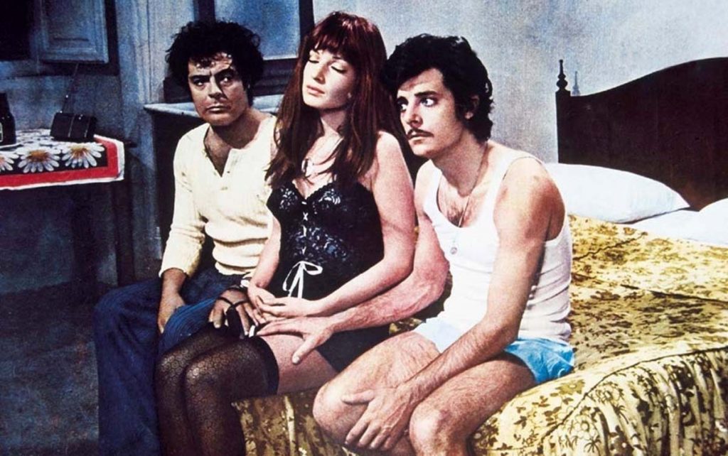 Vitti's underwear recalls the outfit of Sophia Loren in Ieri, oggi, domani.