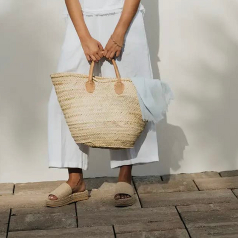 woman holding market basket