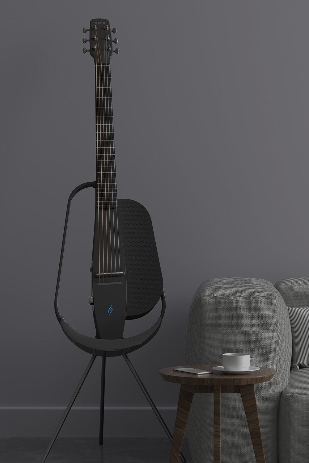 Enya nexg 2 black guitar placed on a black wireless charging stand next to a sofa set in the living room