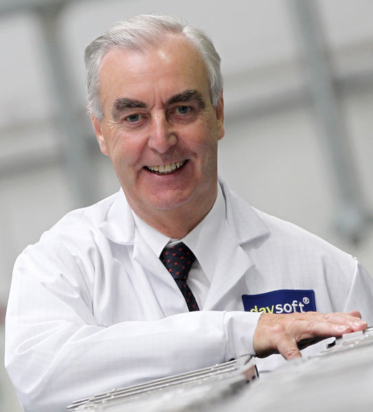 daysoft Chairman Dr Ron Hamilton smiling wearing a daysoft lab coat