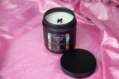 sadist massage candle with hemp coconut soy wax, a wooden x shaped wick and dark rose and labdanum scent