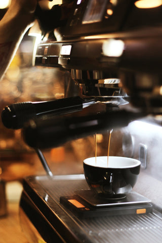 Espresso shot into cup