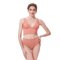 Woman wearing orange lingerie set