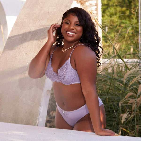 A woman in lace lavender panties and bra