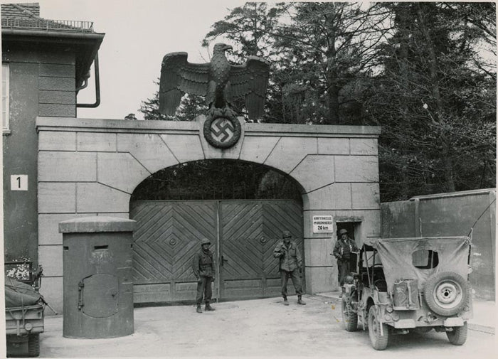 U.S. Soldiers at the entrance of Dachau after liberation