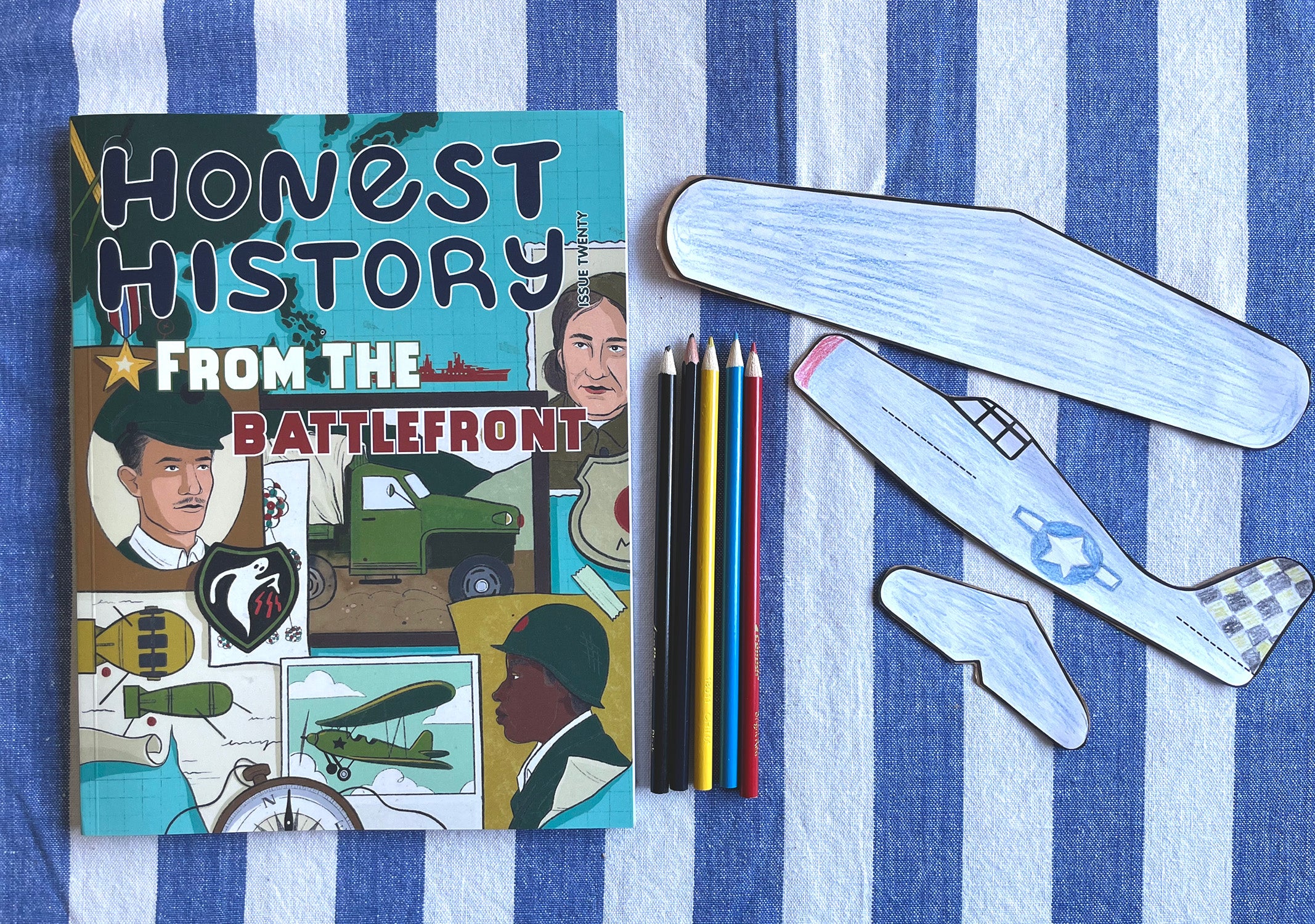 Honest History magazine with airplane template and pencils