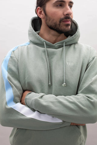 Bearded male models the Angel Number 1111 Hoodie with his arms crossed