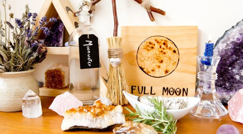 Full moon ritual tools like crystals and moonwater