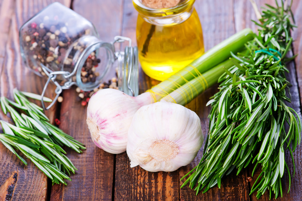 Garlic, rosemary, oil, pepper stock photo