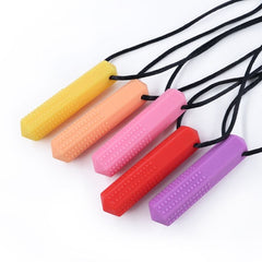 textured pendant chew necklaces in a row from yellow, peach, pink, red, and purple