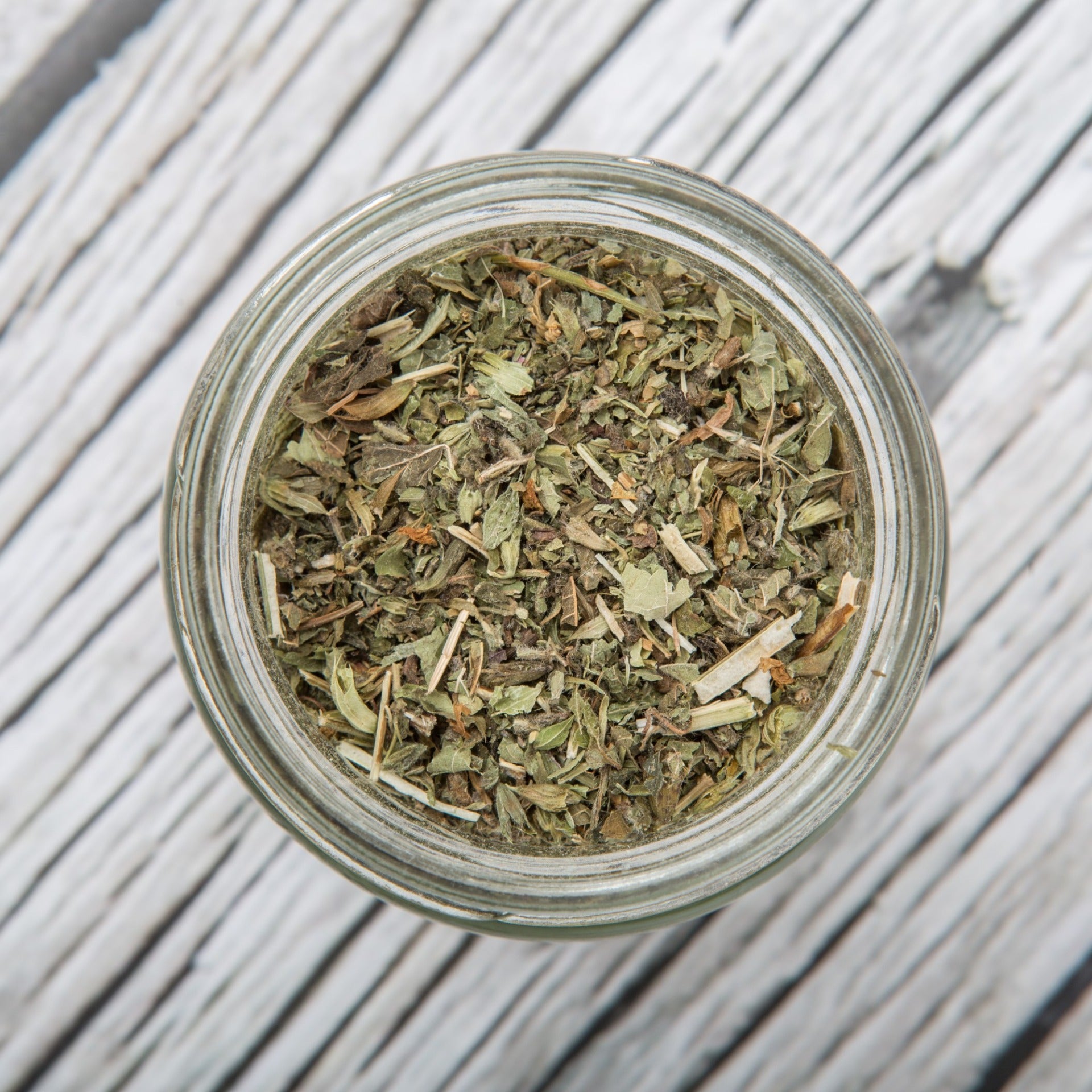 picture of dried lemon balm in a glass bowl