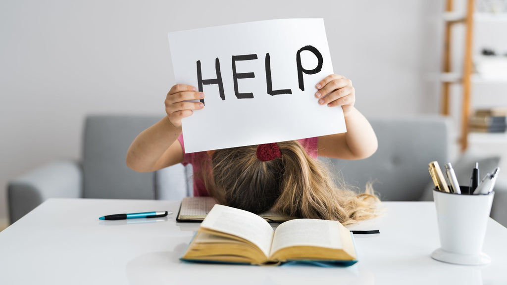 Person with head down in a book holding up a help sign.