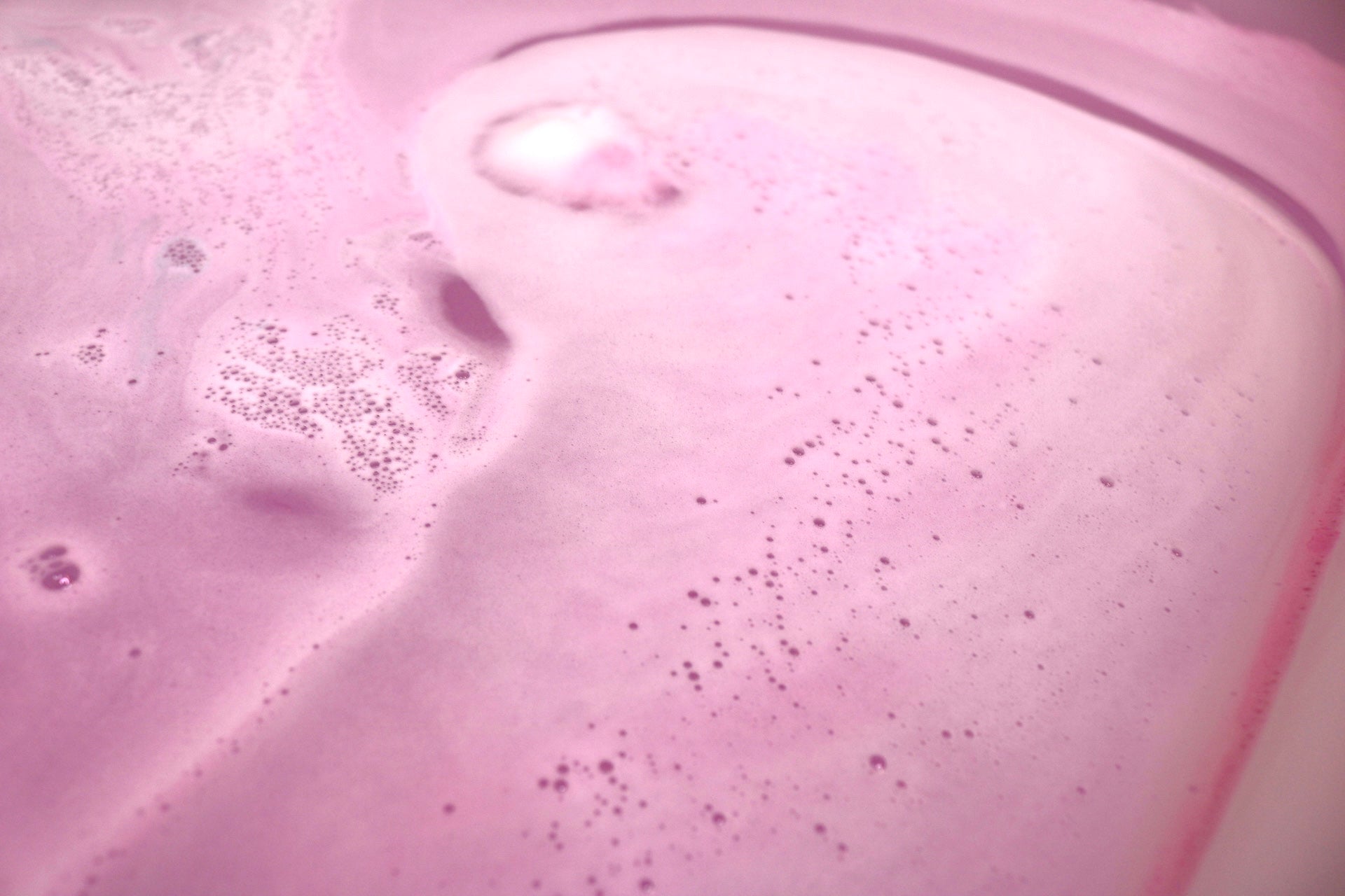 pink bath bomb in water