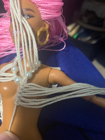 Macrame draping on the doll form
