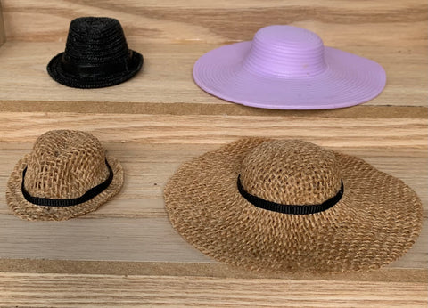 Plastic hat molds in the back row and the burlap "straw" creation in the front row.