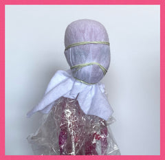 Doll head wrapped with T-shirt front view